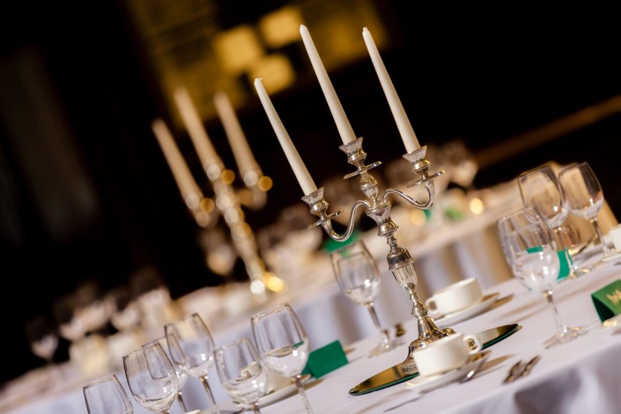 Candlesticks on the tables before wedding reception